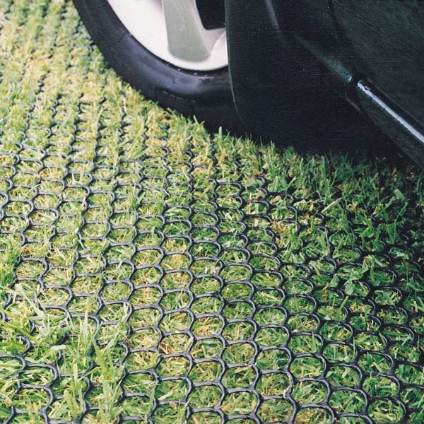 The vehicle is parked on the grass with lawn reinforcement net.