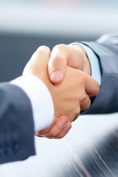 2 men are shaking hands.