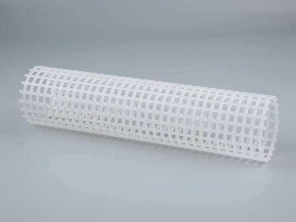 White plastic filter net on a gray background