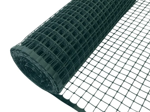 Green plastic garden fence on a white background