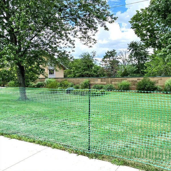 Plastic garden fence is used to protect the lawn.