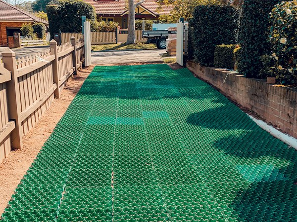 Plastic grass paver is paved on the courtyard doorway.