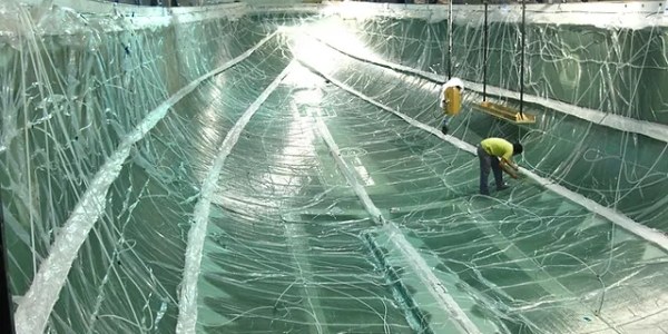The worker is performing the vacuum injection.