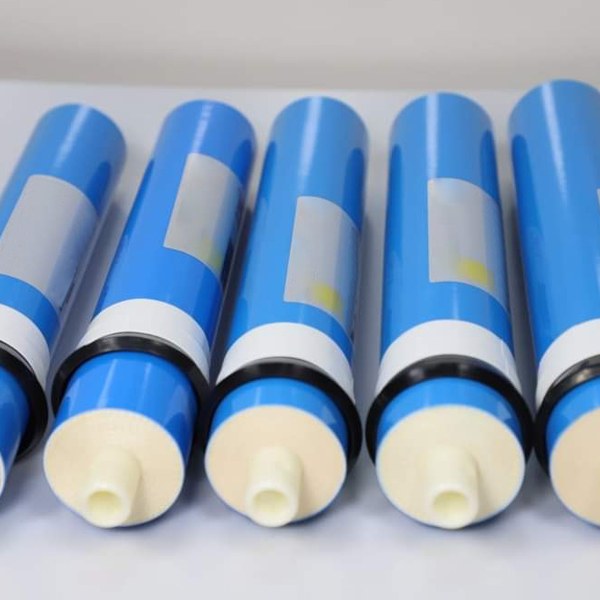 5 blue spiral wound membrane elements on a gray background