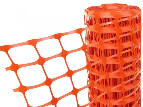 Orange safety barrier mesh on a white background